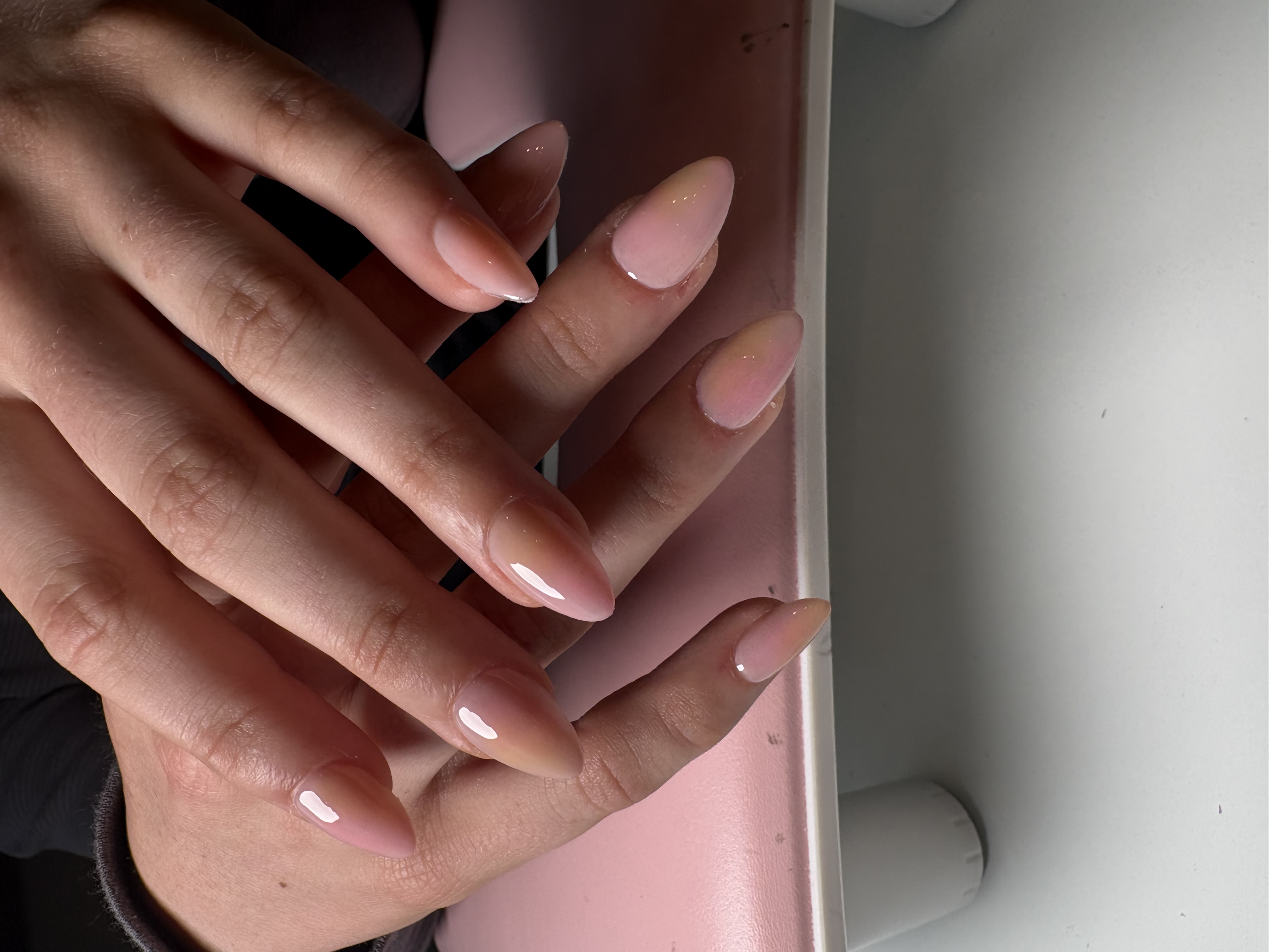 Solid glossy nude glazed-donut almond nails